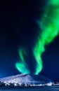 Northern lights in the mountains house of Svalbard, Longyearbyen city, Spitsbergen, Norway wallpaper Royalty Free Stock Photo