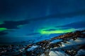 Northern lights over the fjord and mountains, nearby Nuuk city,