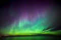 Northern lights over lake in finland Royalty Free Stock Photo