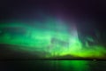 Northern lights over lake in finland Royalty Free Stock Photo