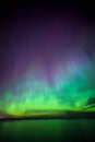 Northern lights over lake in finland Royalty Free Stock Photo