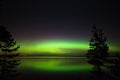 Northern lights over lake in finland Royalty Free Stock Photo