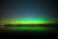 Northern lights over lake in finland Royalty Free Stock Photo