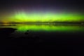 Northern lights over lake in finland Royalty Free Stock Photo