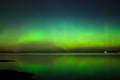 Northern lights over lake in finland Royalty Free Stock Photo