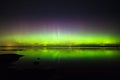 Northern lights over lake in finland Royalty Free Stock Photo