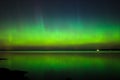 Northern lights over lake in finland Royalty Free Stock Photo