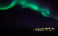 Northern lights over old harbor of Nuuk city