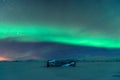 Northern lights over plane wreck on the wreck beach in Vik, Iceland Royalty Free Stock Photo