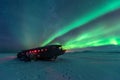 Northern lights over plane wreck on the wreck beach in Vik, Iceland