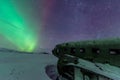 Northern lights over plane wreck on the wreck beach in Vik, Iceland