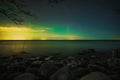 Northern lights over the sea, view from the Viimsi shore in winter Royalty Free Stock Photo