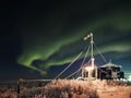 Northern lights over a workstation in the tundra
