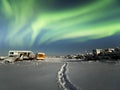 Northern lights over a workstation in the tundra. Taimyr