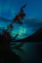 Northern Lights above lake with reflection of Aurora