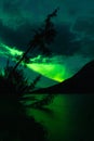 Northern Lights above lake with reflection of Aurora