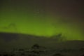 Northern lights with snowy mountains in the foreground Royalty Free Stock Photo