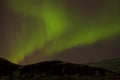 Northern lights with snowy mountains in the foreground Royalty Free Stock Photo