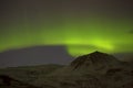 Northern lights with snowy mountains in the foreground Royalty Free Stock Photo