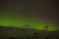 Northern lights with snowy mountains in the foreground Royalty Free Stock Photo