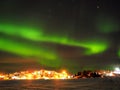 Northern Lights and Stars over City