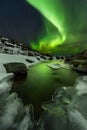 Northern lights under the Barents sea. Polar landscape at the winter night.