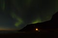 Northern lights over Unstad Beach, the surfers paradise in Lofoten Islands, Norway Royalty Free Stock Photo