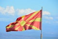 Northern Macedonia`s red and yellow colored flag in wind Royalty Free Stock Photo