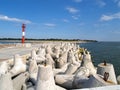 Northern pier with concrete breakwaters and the laser shore rang beacon. Baltiysk, Kaliningrad region Royalty Free Stock Photo