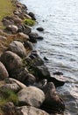 Northern stones near the shore of the reservoir Royalty Free Stock Photo