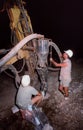 Two workers collecting core samples