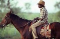 Australian Aborignal stockman on horseback Royalty Free Stock Photo