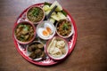 Northern Thai cuisine.Top view set of Thai northern food,  Pork curry, chili dip, minced pork salad, soft boiled vegetables and Th Royalty Free Stock Photo