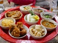 Northern Thai customary style dinner khantok with a variety of local menus