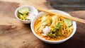 Northern Thai food, spicy curry noodles soup with coconut milk and chicken Royalty Free Stock Photo