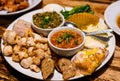 Northern Thai food starter plate - Thai sausage, pork rind and vegetable with red and green chili paste Royalty Free Stock Photo