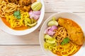 Northern Thai noodle curry soup with chicken and braised pork Royalty Free Stock Photo