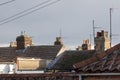 Northern town tiled roof tops with chimneys and aerials UK