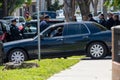 LAPD Metro Division officers and detectives huddle after Valley Homicide Detectives serve a warran