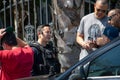 LAPD Metro Division officers and detectives huddle after Valley Homicide Detectives serve a warrant