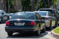 Unmarked police cars parked at the scene as LAPD Valley Homicide Dectectives serve a warrant