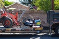 Northridge, California, USA - A City of Los Angeles Sanitation department employee places illegally dumped