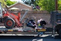 Northridge, California, USA - April 21, 2020: A City of Los Angeles Sanitation department employee places illegally dumped