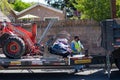 A City of Los Angeles Sanitation department employee loads illegally dumped abandoned bulk refus