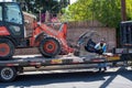 A City of Los Angeles Sanitation department worker loads a Kubota R530 wheel loader