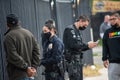 Two LAPD officers making an arrest and questioning a witness. Royalty Free Stock Photo