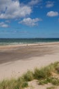 Northumberland beach and coast at Bamburgh north east England UK with view to the Farne islands Royalty Free Stock Photo