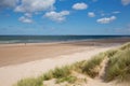 Northumberland white sandy beach and coast at Bamburgh north east England UK Royalty Free Stock Photo