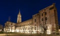 Northwest side of Saint Sernin Basilica lit up at night, in Toulouse in Occitanie, France Royalty Free Stock Photo