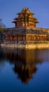 Northwestern tower of the Forbidden City reflecting in the water in Beijing Royalty Free Stock Photo